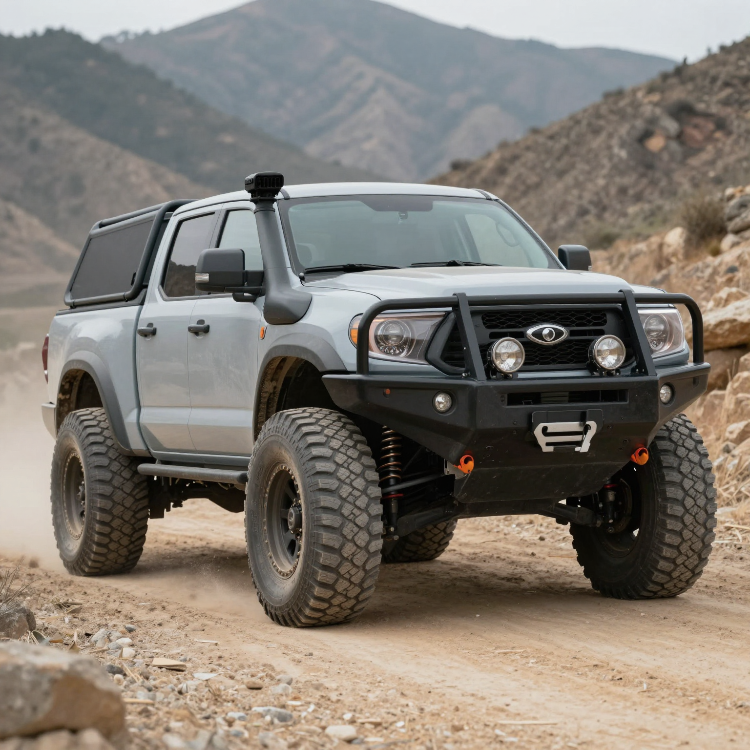 A rugged off-road truck on a mountain terrain